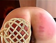 Filthy young slut naked on all fours across the table gets brutal spanking - swollen cheeks